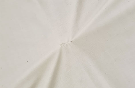 Topper mit Fadenheftung